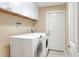 A convenient laundry room features a modern washer and dryer set at 1300 Ariana Woods Cir, Auburndale, FL 33823