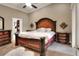 Luxurious main bedroom features a decorative bed frame, a ceiling fan and a walk-in closet at 1300 Ariana Woods Cir, Auburndale, FL 33823