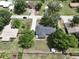 Aerial image of house in quiet residential neighborhood, featuring lots of trees and green spaces at 1315 Costine Dr, Lakeland, FL 33809