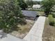 Aerial view of the house showcasing the updated roof and long driveway at 1315 Costine Dr, Lakeland, FL 33809