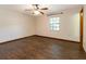 Cozy bedroom with wood floors, natural light, and a ceiling fan at 1315 Costine Dr, Lakeland, FL 33809