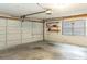 The garage features a white garage door and shelving at 1315 Costine Dr, Lakeland, FL 33809