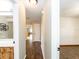 This hallway has wood floors and provides access to the bathroom and bedroom at 1315 Costine Dr, Lakeland, FL 33809
