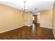 Spacious living room featuring updated flooring, neutral paint and a modern light fixture at 1315 Costine Dr, Lakeland, FL 33809