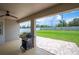 Outdoor patio with BBQ grill, brick pavers, ceiling fan and a spacious fenced yard at 133 Cloverbrook Trl, Davenport, FL 33837