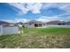 Expansive backyard with storage shed and patio, ideal for outdoor activities and relaxation at 133 Cloverbrook Trl, Davenport, FL 33837