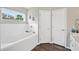 Bright bathroom features a large tub and a window allowing natural light at 133 Cloverbrook Trl, Davenport, FL 33837