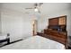 This cozy bedroom has a ceiling fan, closet and a dresser for ample storage at 133 Cloverbrook Trl, Davenport, FL 33837