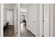 Hallway showcases multiple interior doors and wood-look flooring at 133 Cloverbrook Trl, Davenport, FL 33837