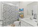 The bathroom is well-appointed with a shower, toilet, and vanity with storage at 1371 Madison Cir, Haines City, FL 33844