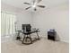 View of a bedroom featuring a black work desk, ceiling fan and window with natural light at 1371 Madison Cir, Haines City, FL 33844