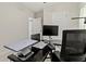Bedroom featuring a workspace with a black desk, modern computer, and comfortable office chair at 1371 Madison Cir, Haines City, FL 33844