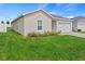 Charming home with lush green lawn and simple landscaping, located in a desirable neighborhood at 1371 Madison Cir, Haines City, FL 33844