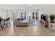 Spacious living room with plenty of natural light, stylish furniture and tile floors at 1371 Madison Cir, Haines City, FL 33844