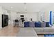 Cozy living room area features an open concept with a kitchen, island with bar seating at 1371 Madison Cir, Haines City, FL 33844