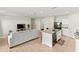 Open floorplan with tile floors featuring a living area and a modern kitchen with granite countertops at 1371 Madison Cir, Haines City, FL 33844