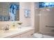 Cozy bathroom features a classic vanity, decorative wallpaper, and a soothing ambiance at 1610 Reynolds Rd # 204, Lakeland, FL 33801