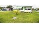 Charming single-story home with a lush green lawn and mature landscaping at 1610 Reynolds Rd # 204, Lakeland, FL 33801