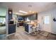 Bright kitchen boasts blue cabinetry, butcher block counters, and a convenient door to the outside at 1610 Reynolds Rd # 204, Lakeland, FL 33801