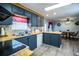 Well-lit kitchen featuring efficient appliances and convenient access to the dining area at 1610 Reynolds Rd # 204, Lakeland, FL 33801