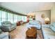 Inviting living room with ample natural light, comfortable seating, and a view to dining area at 1610 Reynolds Rd # 204, Lakeland, FL 33801