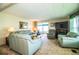 Cozy living room with comfortable seating, a fireplace, and sliding door access at 1610 Reynolds Rd # 204, Lakeland, FL 33801