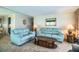 Comfortable living room featuring plush sofas, warm lighting, and stylish decor at 1610 Reynolds Rd # 204, Lakeland, FL 33801