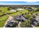 Expansive aerial view showcasing the Grasslands golf course, water features, and residential areas at 1739 Laurel Glen Pl, Lakeland, FL 33803