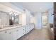 Bathroom featuring granite countertops, white cabinets, and tiled floors at 1739 Laurel Glen Pl, Lakeland, FL 33803