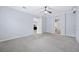 Bright bedroom with carpet floors, ceiling fan, and neutral color scheme at 1739 Laurel Glen Pl, Lakeland, FL 33803