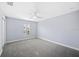 Neutral bedroom includes a window and a ceiling fan at 1739 Laurel Glen Pl, Lakeland, FL 33803