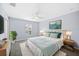 Airy bedroom featuring soft colors, plush bedding, and natural wood accents for a tranquil, inviting retreat at 1739 Laurel Glen Pl, Lakeland, FL 33803