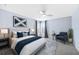 Serene bedroom with blue accents, neutral tones, and ample natural light creating a peaceful and inviting space at 1739 Laurel Glen Pl, Lakeland, FL 33803
