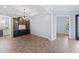 Dining room with dark wood built-in cabinets, chandelier lighting, and views to the hall and side entry at 1739 Laurel Glen Pl, Lakeland, FL 33803