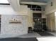 Entrance to the Grasslands Golf and Country Club with stone wall detail at 1739 Laurel Glen Pl, Lakeland, FL 33803