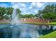 The Grasslands community entrance boasts lush landscaping and a calming fountain at 1739 Laurel Glen Pl, Lakeland, FL 33803