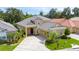 Well maintained home with a tile roof, manicured lawn, and a welcoming front entrance at 1739 Laurel Glen Pl, Lakeland, FL 33803