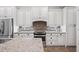 Gourmet kitchen with granite countertops, stainless appliances, and mosaic backsplash for a modern design at 1739 Laurel Glen Pl, Lakeland, FL 33803
