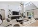 Open living room with high ceilings, modern decor, and sliding doors to a pool area for a bright, airy feel at 1739 Laurel Glen Pl, Lakeland, FL 33803
