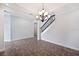 Open living room with decorative lighting, staircase, and views to the side entry and adjacent rooms at 1739 Laurel Glen Pl, Lakeland, FL 33803