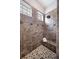 Tiled shower with glass block windows, built in seating, and tiled flooring at 1739 Laurel Glen Pl, Lakeland, FL 33803