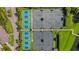 Aerial view of several outdoor tennis courts and surrounding greenery of a meticulously maintained community at 1739 Laurel Glen Pl, Lakeland, FL 33803