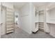 Walk-in closet with custom shelving, and carpet flooring at 1739 Laurel Glen Pl, Lakeland, FL 33803