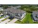 Inviting aerial view showcases townhouses with modern design, pristine lawns, and convenient parking at 1754 Sanibel Dr, Davenport, FL 33896