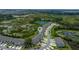 Serene aerial of townhouses nestled near a lush conservation area, offering privacy and natural beauty at 1754 Sanibel Dr, Davenport, FL 33896
