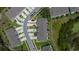 Unique aerial perspective of townhouses with ample parking, manicured lawns, and conservation area at 1754 Sanibel Dr, Davenport, FL 33896