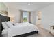 Bright bedroom featuring a cozy bed and an ensuite bathroom for added convenience at 1754 Sanibel Dr, Davenport, FL 33896