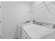 Efficient laundry room equipped with modern washer and dryer units for added convenience at 1754 Sanibel Dr, Davenport, FL 33896
