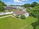 Aerial view of a home with a well-manicured lawn and mature trees at 1820 Salem Rd, Lakeland, FL 33803