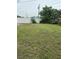 Expansive backyard with lush green grass and privacy fence, perfect for outdoor activities at 1820 Salem Rd, Lakeland, FL 33803